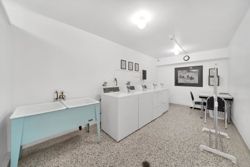 a laundry room with a sink and washer and dryer