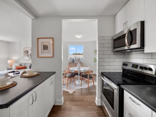 a kitchen and dining area in a 555 waverly unit