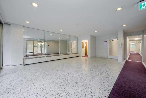 a large room with a large mirror
