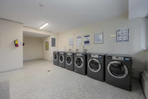 a row of washing machines in a laundromat