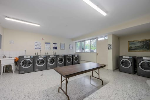 a washer and dryer room in a laundromat