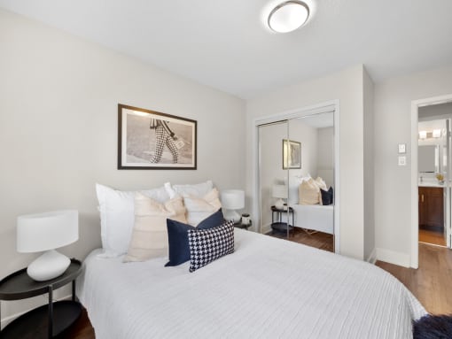 a bedroom with a bed and a doorway to a bathroom