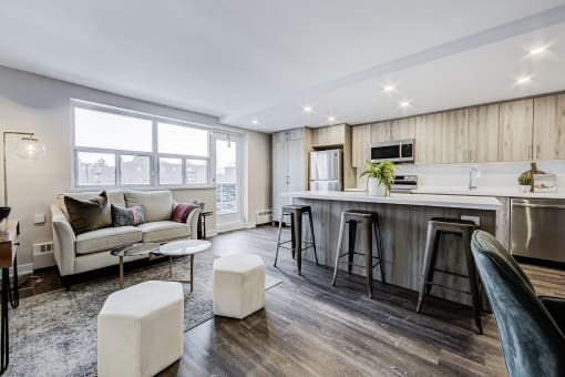 a kitchen and living room with a large window