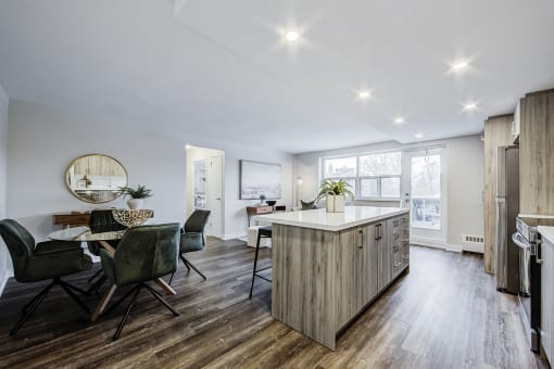 a kitchen and dining area in a 555 waverly unit