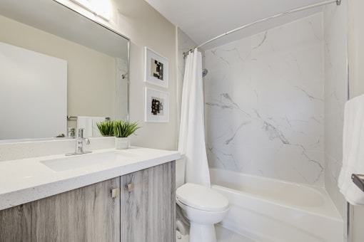 a bathroom with a sink toilet and bathtub