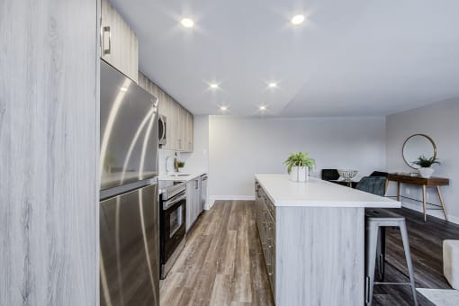 a kitchen and dining area in a 555 waverly unit
