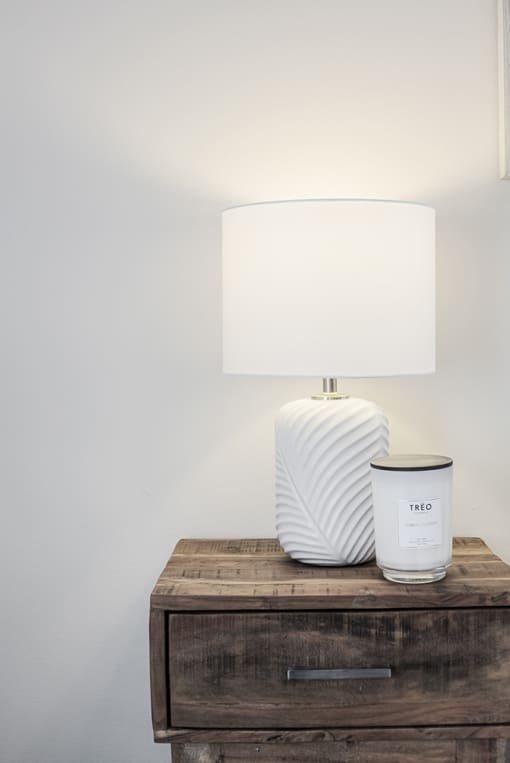 a lamp on a table with a lampshade