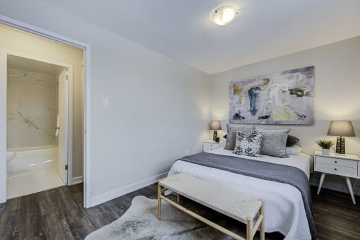 a bedroom with a bed and two night stands