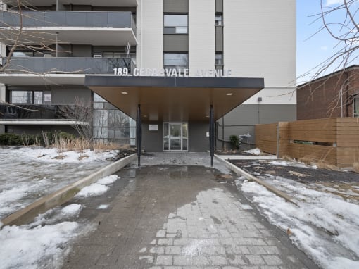 a view of the front of the building with snow on the ground