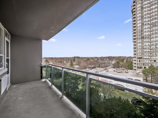 a balcony with a view of a city
