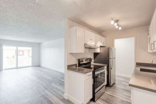 a kitchen and living room in an apartment