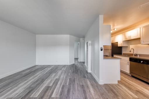 a kitchen and living room in a 555 waverly unit