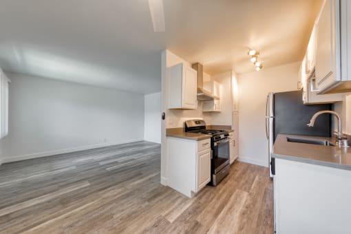 a kitchen and living room in a 555 waverly unit