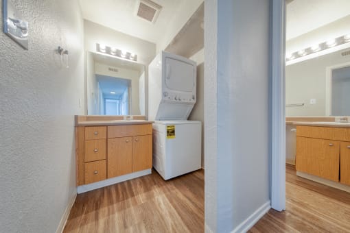 a bathroom with a washer and dryer