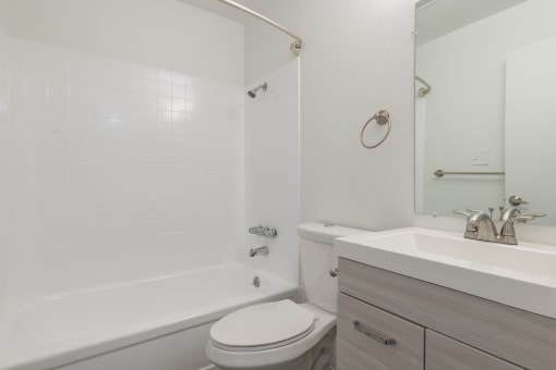 a bathroom with a sink toilet and bathtub