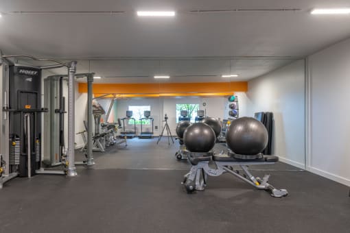 a gym with weights machines and other exercise equipment