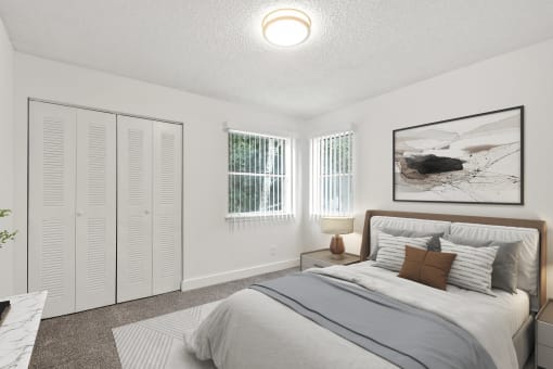 a bedroom with a bed and two windows