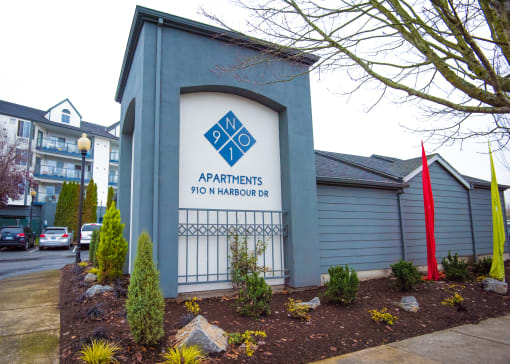 a blue building with a sign on the side of it