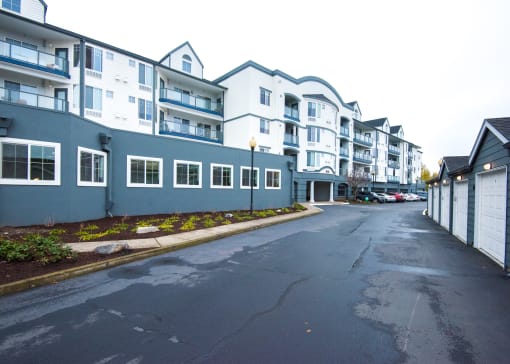 an empty street in front of an apartment building