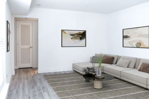 a living room with a couch and a table