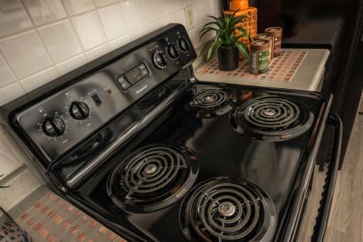 the stove in the kitchen is clean and ready to use