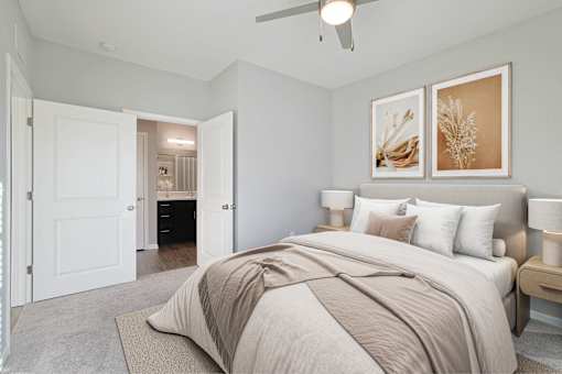 A room with a ceiling fan and carpeted floor.
