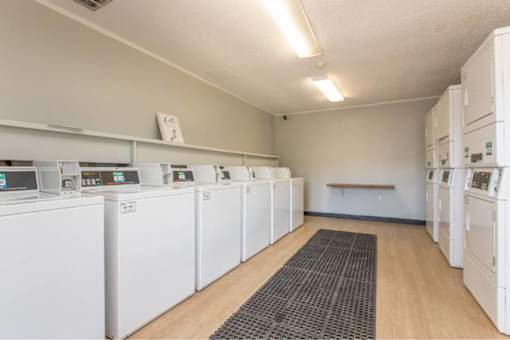 A row of washing machines in a laundromat.