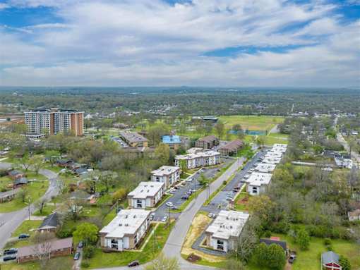 A bird's eye view of a residential area with houses and apartment buildings.