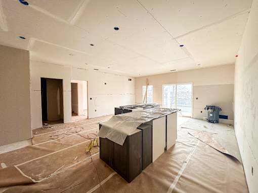 Kitchen under construction with a countertop and cabinets.