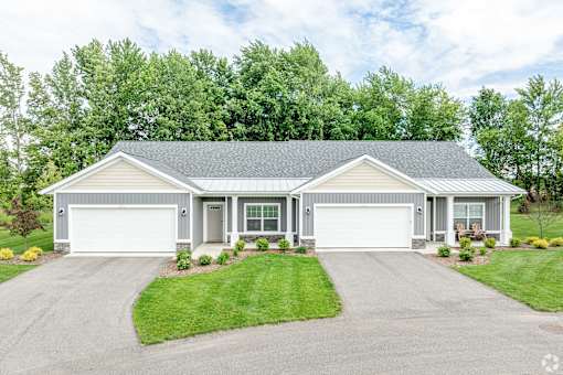 A two-car garage is attached to a house.