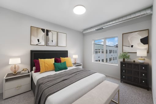 a bedroom with a bed and a window