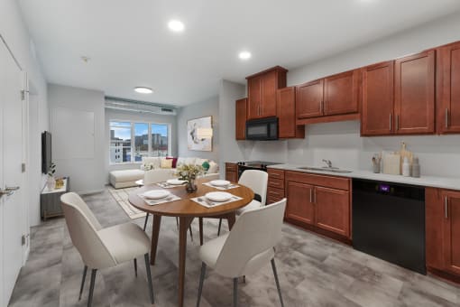 a kitchen and dining room with a table and chairs