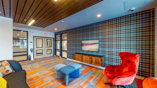 clubroom with tv and plaid wallpaper