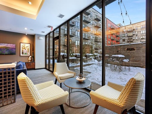 lounge overlooking patio and grilling stations with community herb and vegetable garden