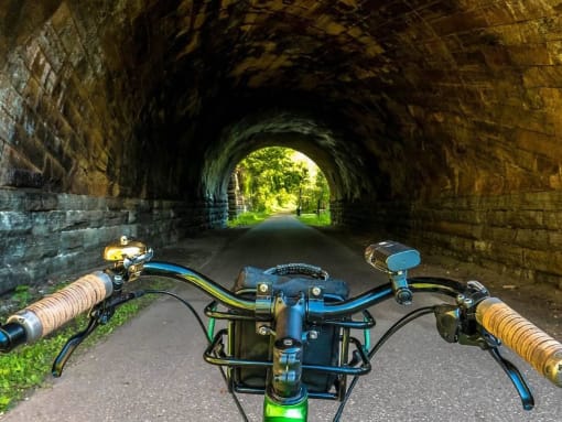a bike is parked in front of a tunnel