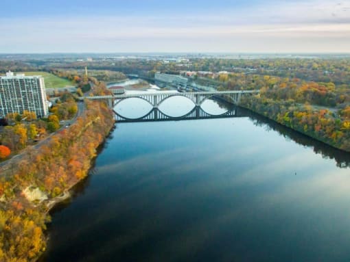 arial view of a river with a bridge in the background