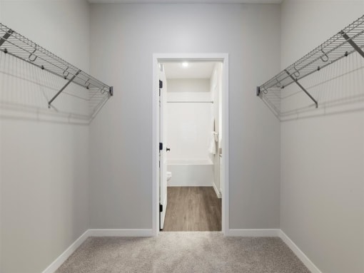 Huge walk in closet with shelving