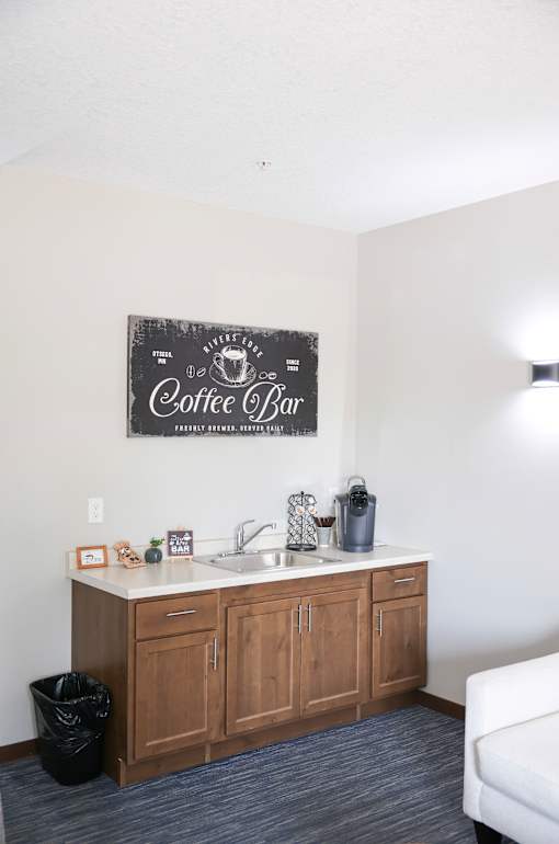 A coffee bar area with a sign on the wall.
