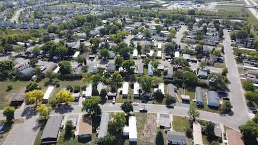 A residential area with houses and trees.