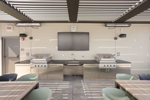 a kitchen with two stoves and two tables