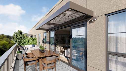 A patio with a table and chairs is covered by a roof.