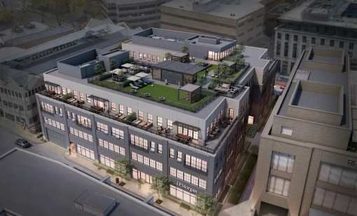 A rendering of a modern building with a green roof and multiple floors.