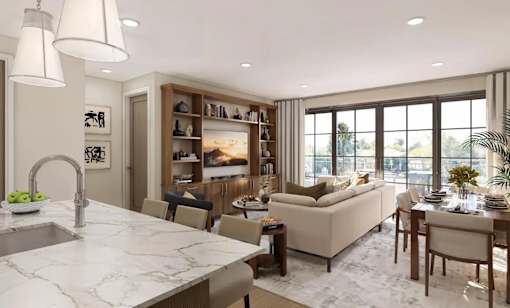 A modern kitchen with a marble countertop and a dining area with a couch and chairs.