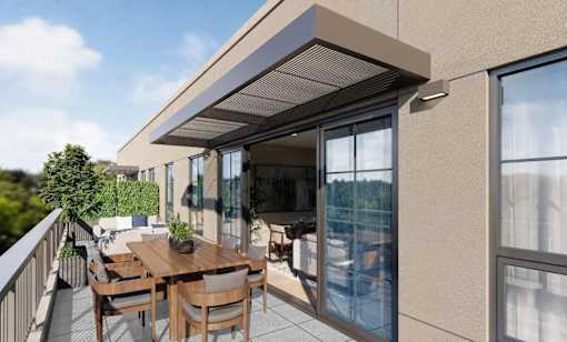 A balcony with a table and chairs is shown.