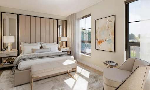 A bedroom with a large bed, a chair, and a painting on the wall.