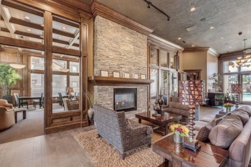 A large living room with a stone fireplace