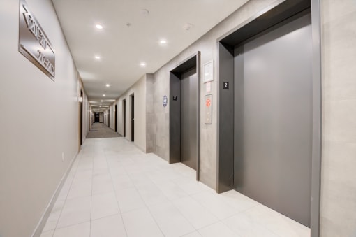 a row of elevators in an office building