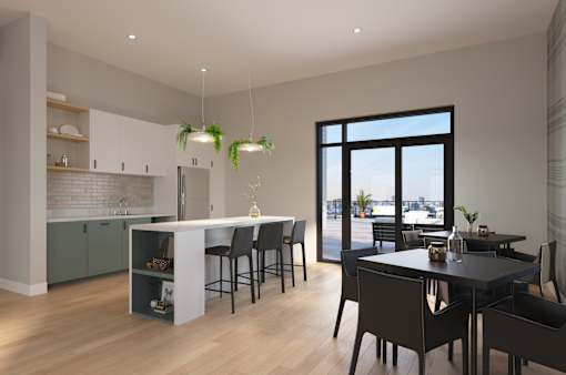 A modern kitchen with a dining table and chairs.