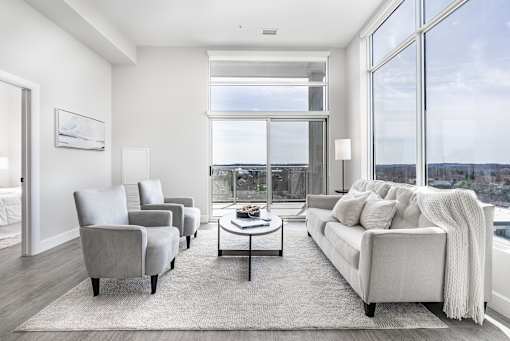 A modern living room with a view of the city.