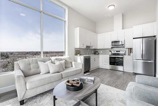 A modern kitchen with a view of the city.